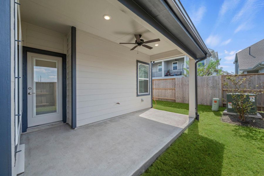 Exterior details and patio area of a home in Meridiana, Manvel (Image 3).