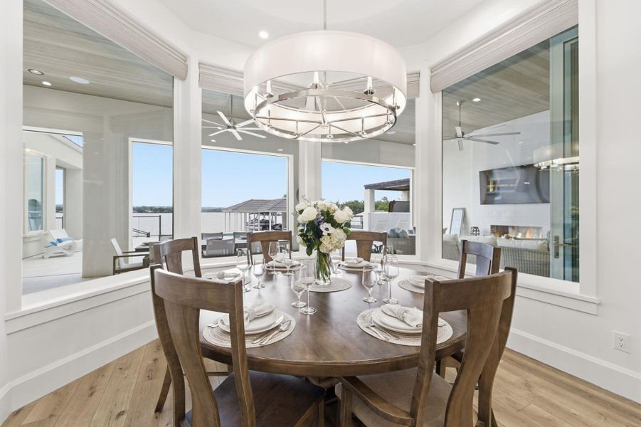 Dining space featuring a ceiling fan, light wood finished floors, and recessed lighting