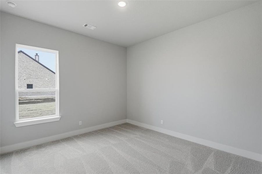 Spare room with carpet flooring and baseboards