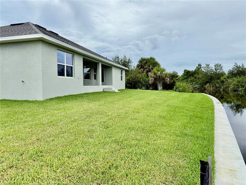 Front exterior of a new home in South Gulf Cove, Port Charlotte, FL, highlighting curb appeal (Image 17).