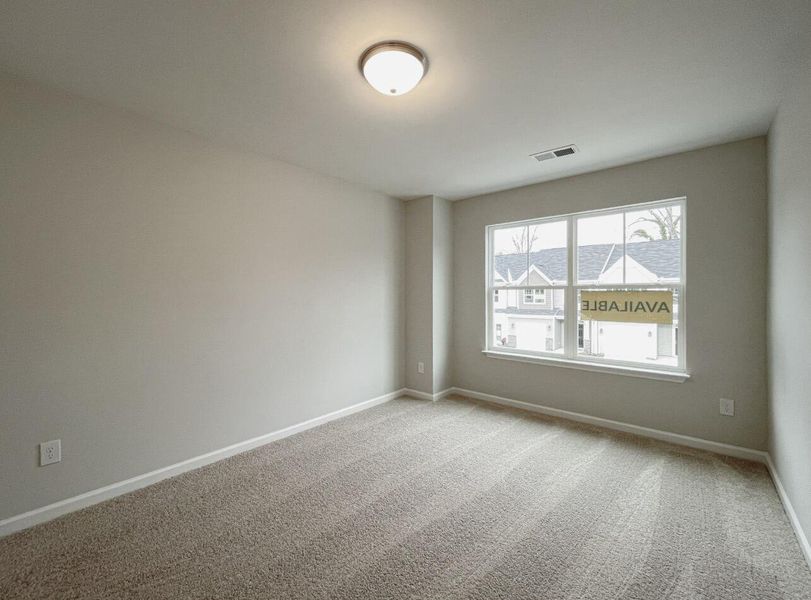 Spacious, unfurnished interior of a new home in East Main Townes, Spartanburg (Image 24).