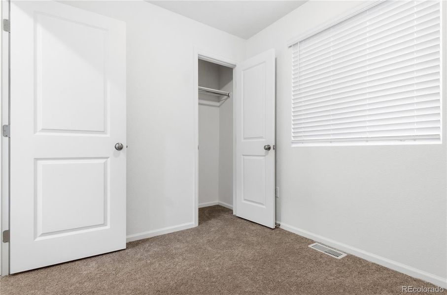 Spacious, unfurnished interior of a new home in Reunion, Commerce City (Image 11).