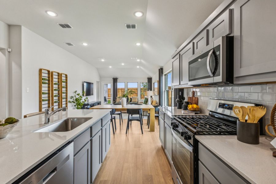 Kitchen in the Turquoise home plan by Trophy Signature Homes – REPRESENTATIVE PHOTO