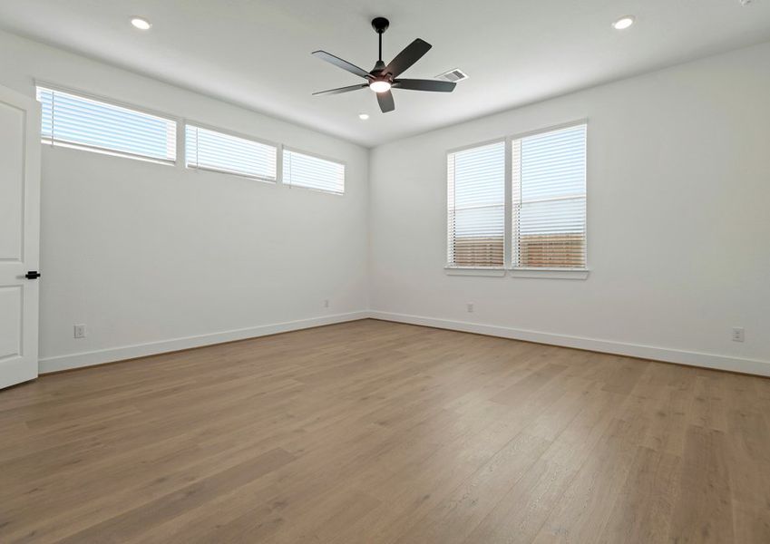 The primary bedroom with plenty of windows.