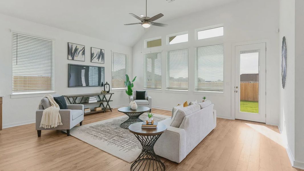 Representative furnished interior of a home built from the Lauren by Chesmar Homes in University Heights, Round Rock (Image 11).