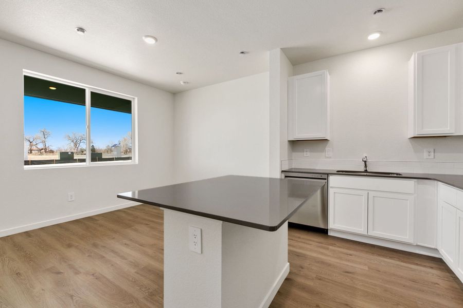 Representative furnished interior of a home built from the Pinecliffe by Baessler Homes in Liberty Draw, Evans (Image 10).