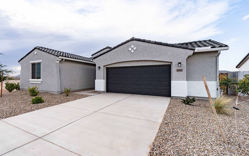 Front exterior of a new home in Rancho Mirage, Maricopa, AZ, highlighting curb appeal (Image 2).
