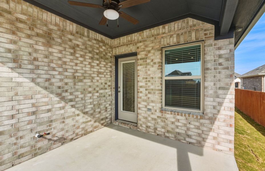 Exterior details and patio area of a home in Saddleback at Santa Rita Ranch, Liberty Hill (Image 24).