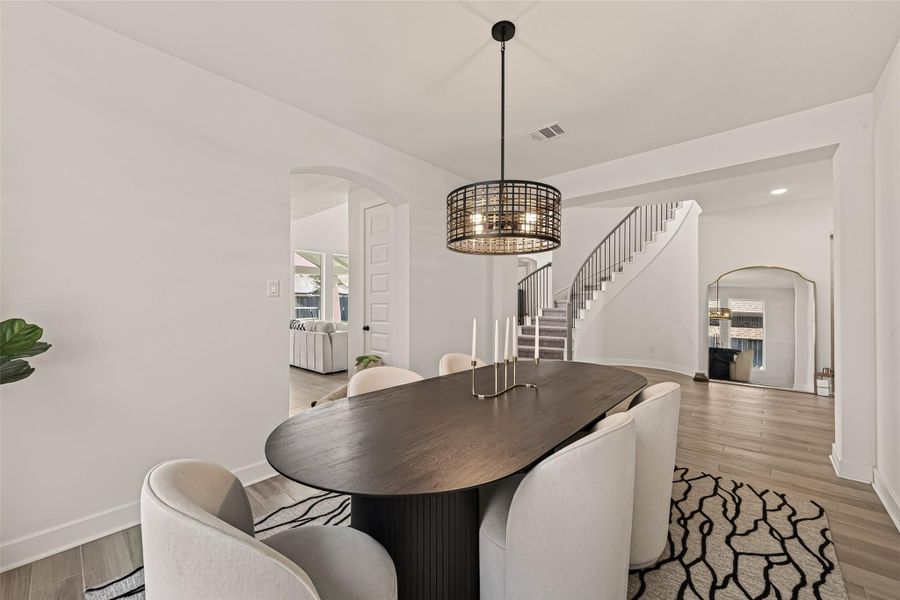 Enjoy elegant dining in this beautifully appointed formal dining room. Enjoy elegant dining in this beautifully appointed formal dining room.