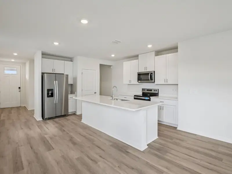 Furnished interior view inside a new home in Magnolia Bay - Premier Series, Nokomis (Image 3).