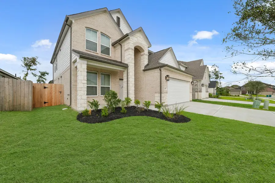Front exterior of a new home in Barton Creek Ranch, Conroe, TX, highlighting curb appeal (Image 1). Front exterior of a new home in Barton Creek Ranch, Conroe, TX, highlighting curb appeal (Image 1).