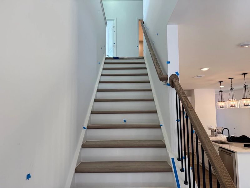 Staircase featuring the AW Collection® Timeless - Classic rails and trim add graceful detail.