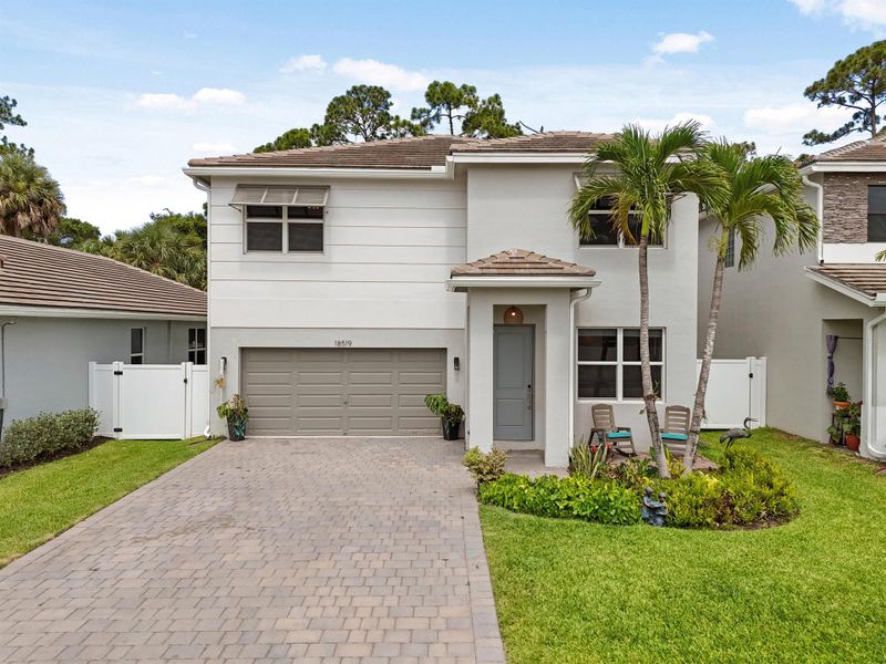 Front exterior of a new home in Reserve at Jupiter, Jupiter, FL, highlighting curb appeal (Image 27).