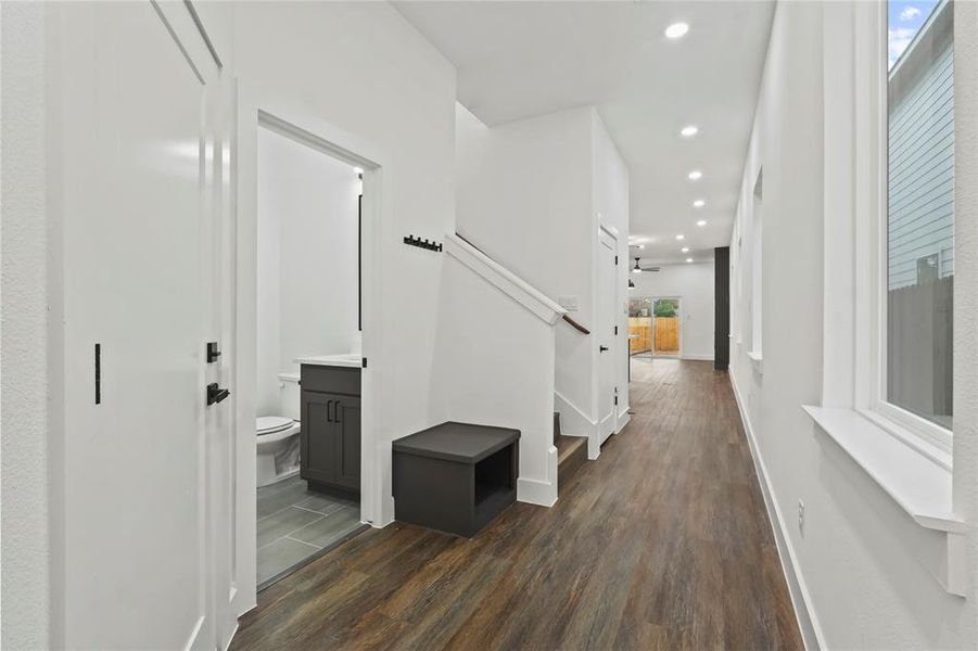 Hall featuring dark wood-style flooring, recessed lighting, and stairway Hall featuring dark wood-style flooring, recessed lighting, and stairway