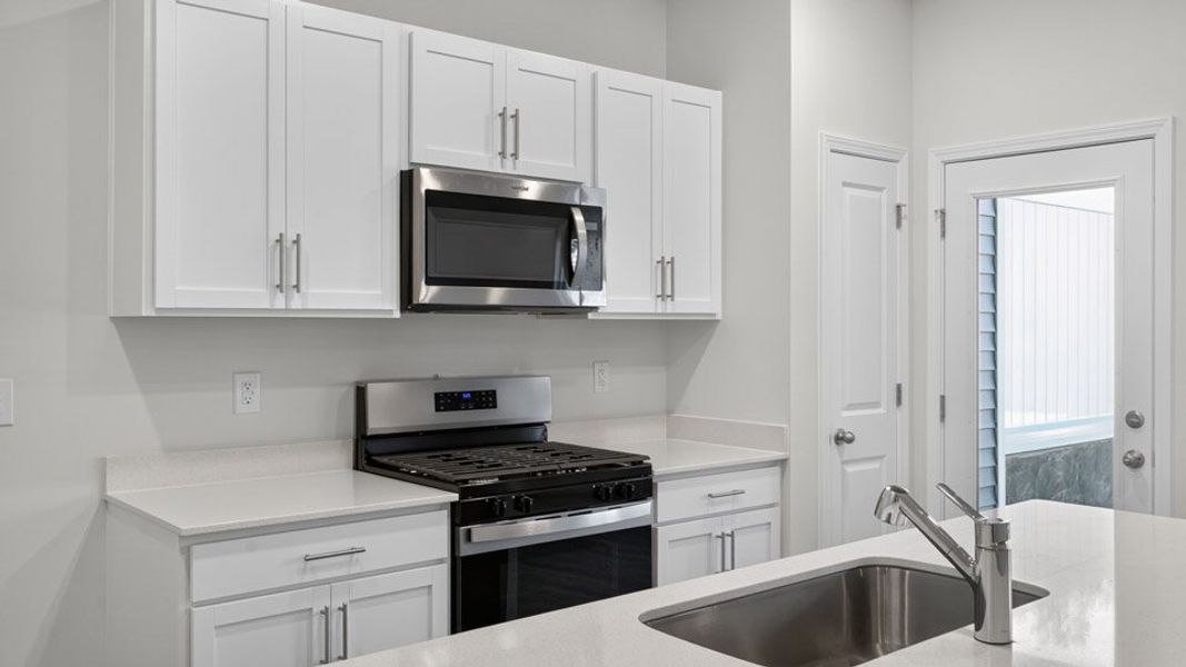 Representative furnished interior of a home built from the MAYWOOD by D.R. Horton in The Townes at Galvins Ridge, Sanford (Image 4).