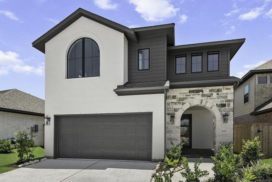 Front exterior of a new home in Candela, Richmond, TX, highlighting curb appeal (Image 2). Front exterior of a new home in Candela, Richmond, TX, highlighting curb appeal (Image 2).