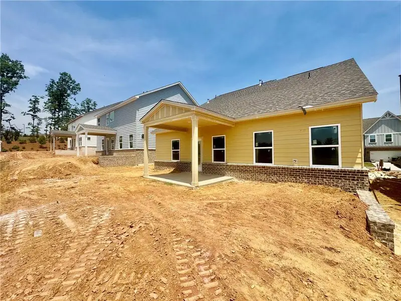 Exterior details and patio area of a home in Eastlyn Crossing, Flowery Branch (Image 4).