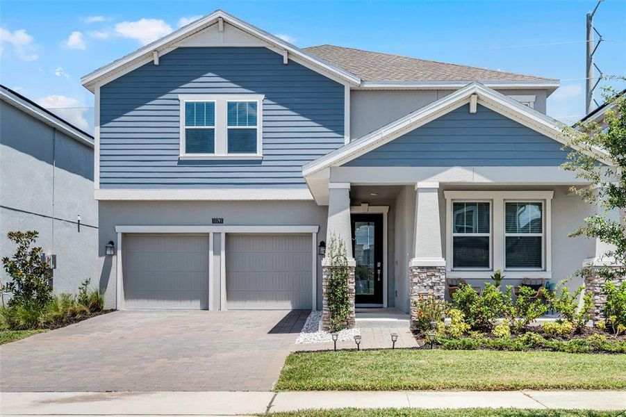 Front exterior of a new home in , Orlando, FL, highlighting curb appeal (Image 26).