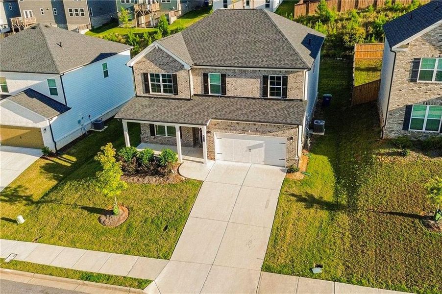 Front exterior of a new home in , South Fulton, GA, highlighting curb appeal (Image 1). Front exterior of a new home in , South Fulton, GA, highlighting curb appeal (Image 1).