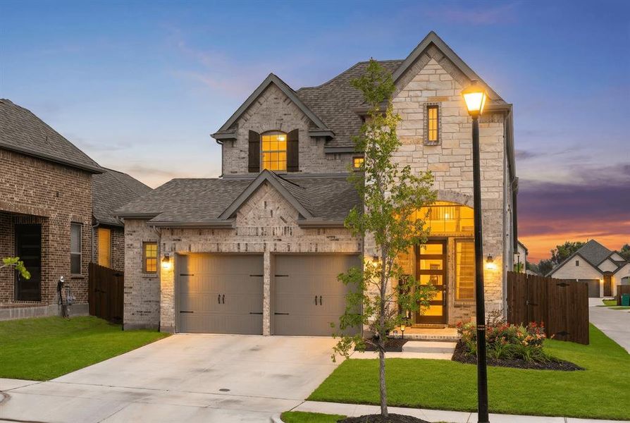 Front exterior of a new home in Avondale, Fate, TX, highlighting curb appeal (Image 1). Front exterior of a new home in Avondale, Fate, TX, highlighting curb appeal (Image 1).