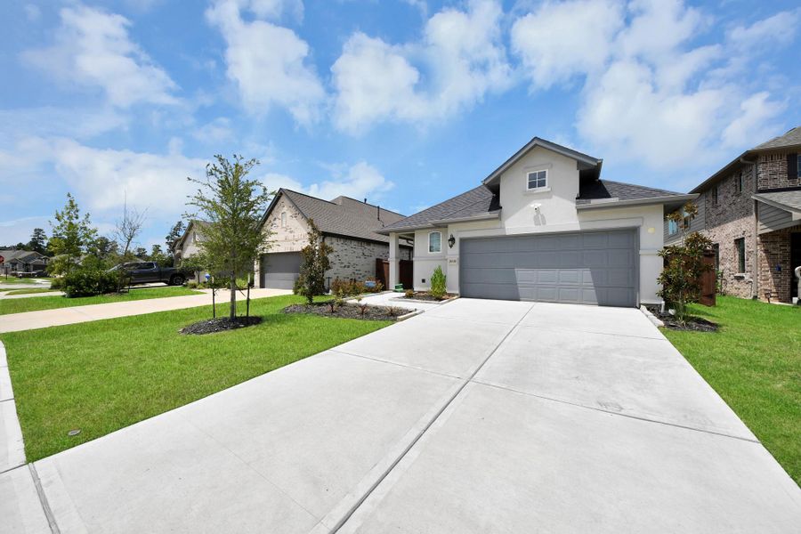 Front exterior of a new home in , Conroe, TX, highlighting curb appeal (Image 25).