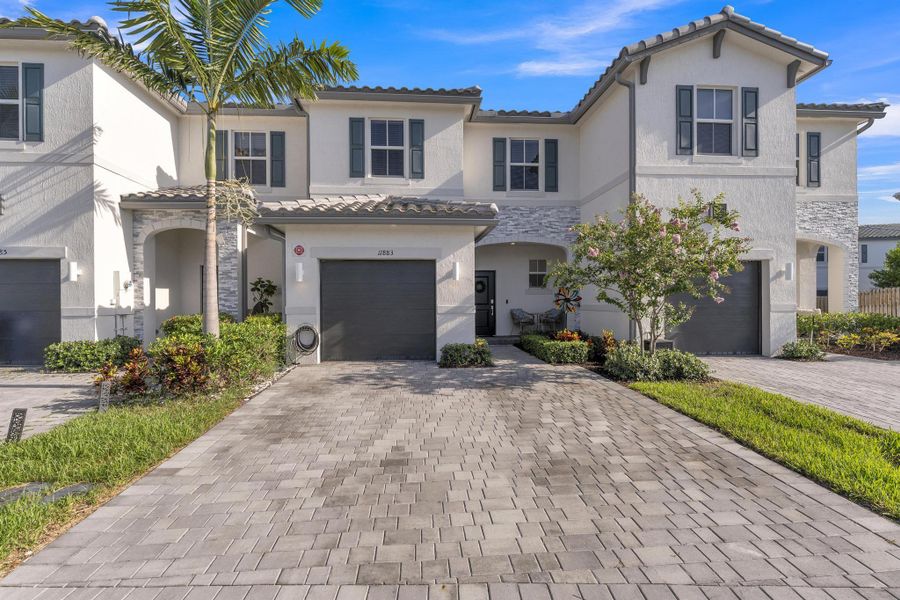 Front exterior of a new home in , Coral Springs, FL, highlighting curb appeal (Image 21).