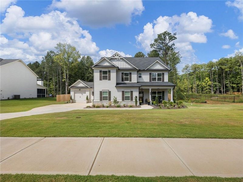Front exterior of a new home in , Bethlehem, GA, highlighting curb appeal (Image 23).