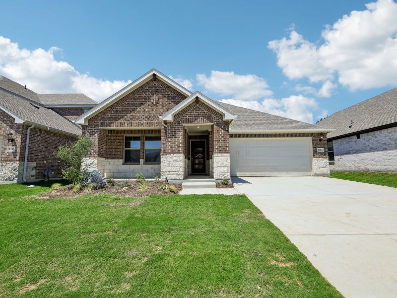 Front exterior of a new home in Stella Hills, Denton, TX, highlighting curb appeal (Image 1). Front exterior of a new home in Stella Hills, Denton, TX, highlighting curb appeal (Image 1).