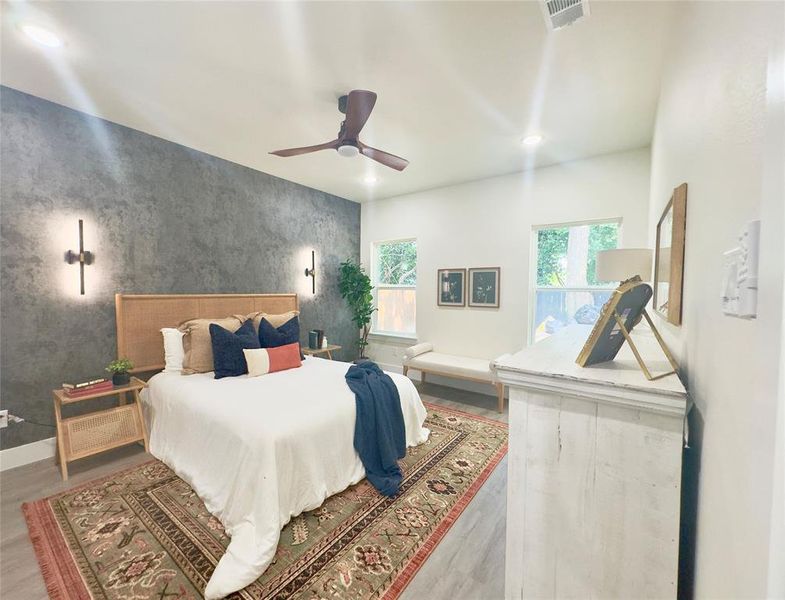 Bedroom featuring ceiling fan and wood-type flooring