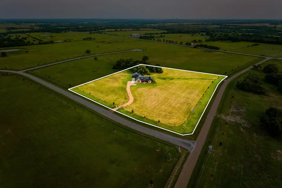 Aerial view of sparsely populated area with property parcel outlined Aerial view of sparsely populated area with property parcel outlined