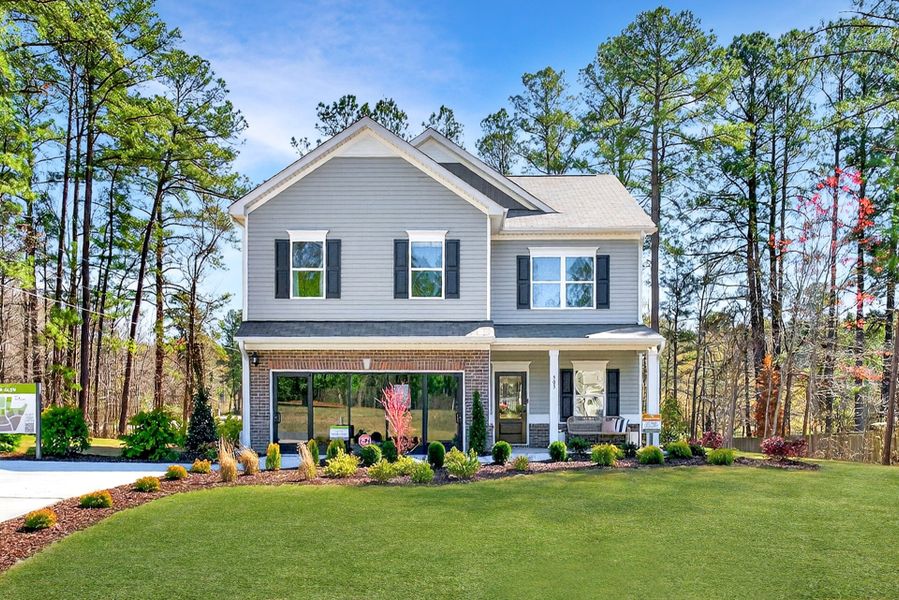 Front exterior of a new home in Arbor Glen, Sanford, NC, highlighting curb appeal (Image 1). Front exterior of a new home in Arbor Glen, Sanford, NC, highlighting curb appeal (Image 1).
