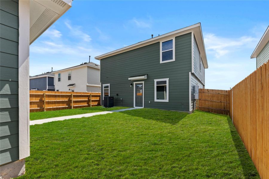 Exterior details and patio area of a home in Prairie Lakes, Buda (Image 3).