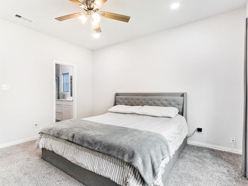 Bedroom featuring light gray carpet flooring and white walls
