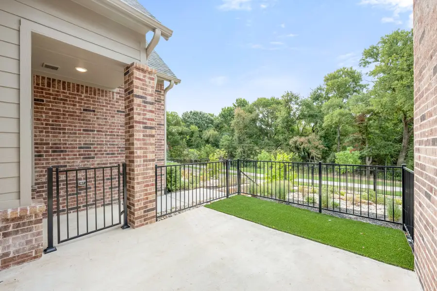 Exterior details and patio area of a home in Cottonwood Creek, Rowlett (Image 3).