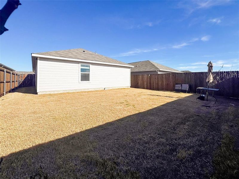 View of fenced backyard