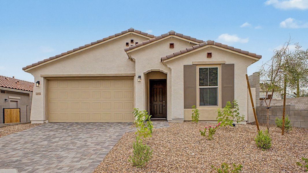 Front exterior of a new home in The Villas at Mystic, Peoria, AZ, highlighting curb appeal (Image 2). Front exterior of a new home in The Villas at Mystic, Peoria, AZ, highlighting curb appeal (Image 2).