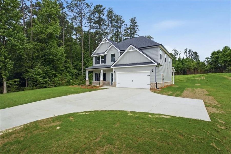 Front exterior of a new home in , Stockbridge, GA, highlighting curb appeal (Image 17). Front exterior of a new home in , Stockbridge, GA, highlighting curb appeal (Image 17).