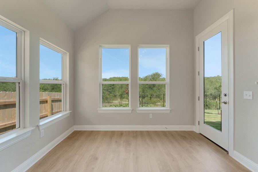 Unfurnished sunroom with lofted ceiling Unfurnished sunroom with lofted ceiling