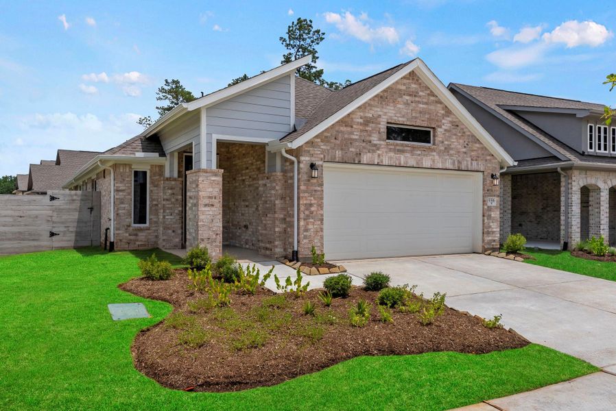 Front exterior of a new home in Two Step Farm, Montgomery, TX, highlighting curb appeal (Image 2). Front exterior of a new home in Two Step Farm, Montgomery, TX, highlighting curb appeal (Image 2).