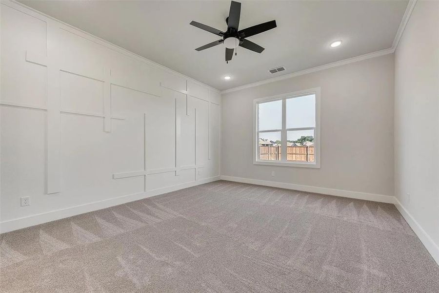 Spare room with ceiling fan, ornamental molding, light carpet, and recessed lighting