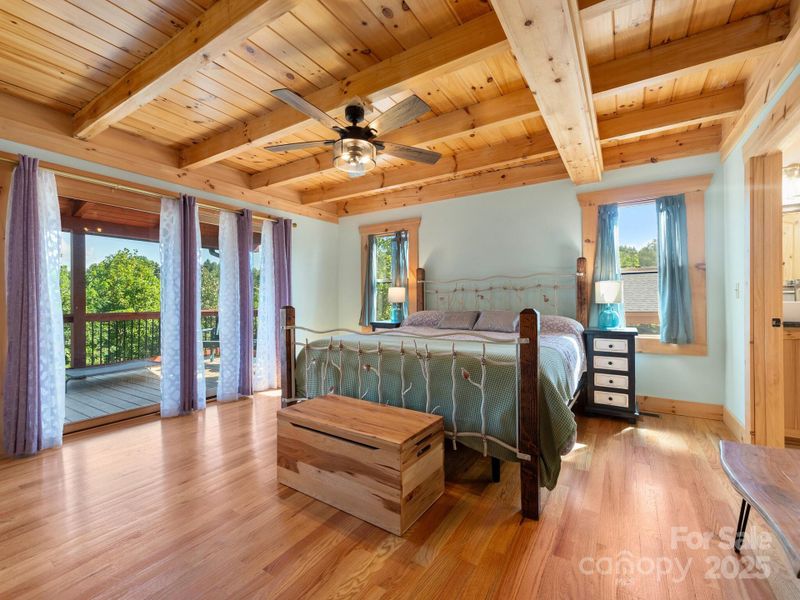 Primary Bedroom With Wood Beam Ceiling