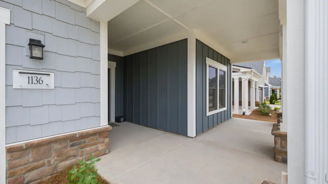 Exterior details and patio area of a home in The Courtyards at Oak Grove, Durham (Image 3).