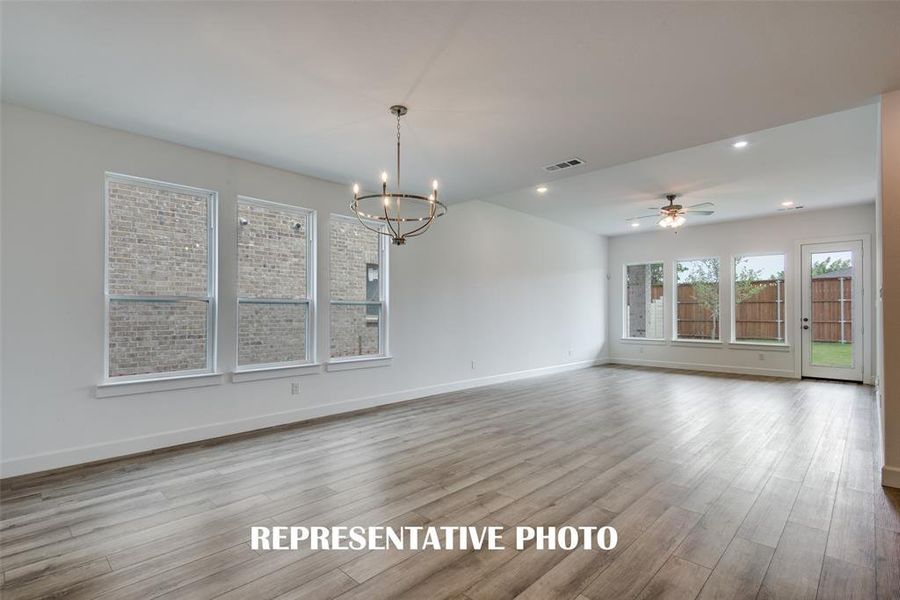 Dining and Family rooms filled with natural light!  REPRESENTATIVE PHOTO