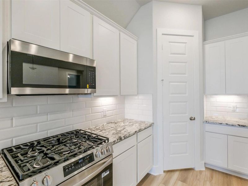 Furnished interior view inside a new home in Sunterra, Katy (Image 11).