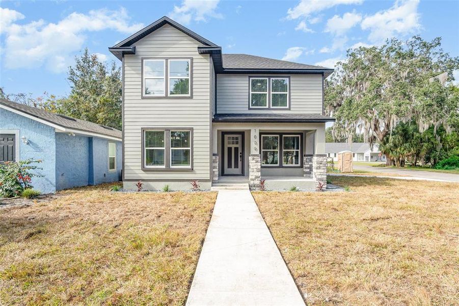 Front exterior of a new home in , Sanford, FL, highlighting curb appeal (Image 1).