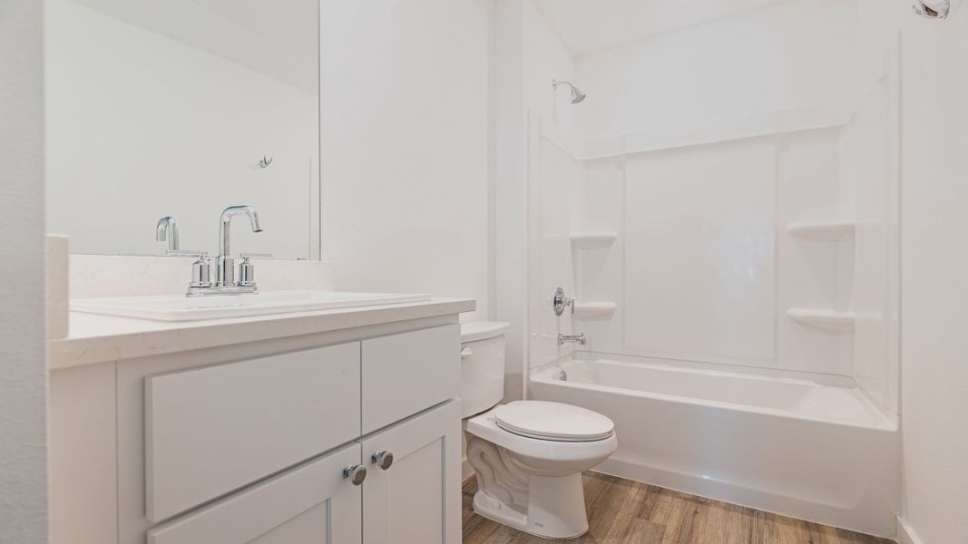 Representative furnished interior of a home built from the The Kendall by D.R. Horton in Overlook West, Wolfforth (Image 7).