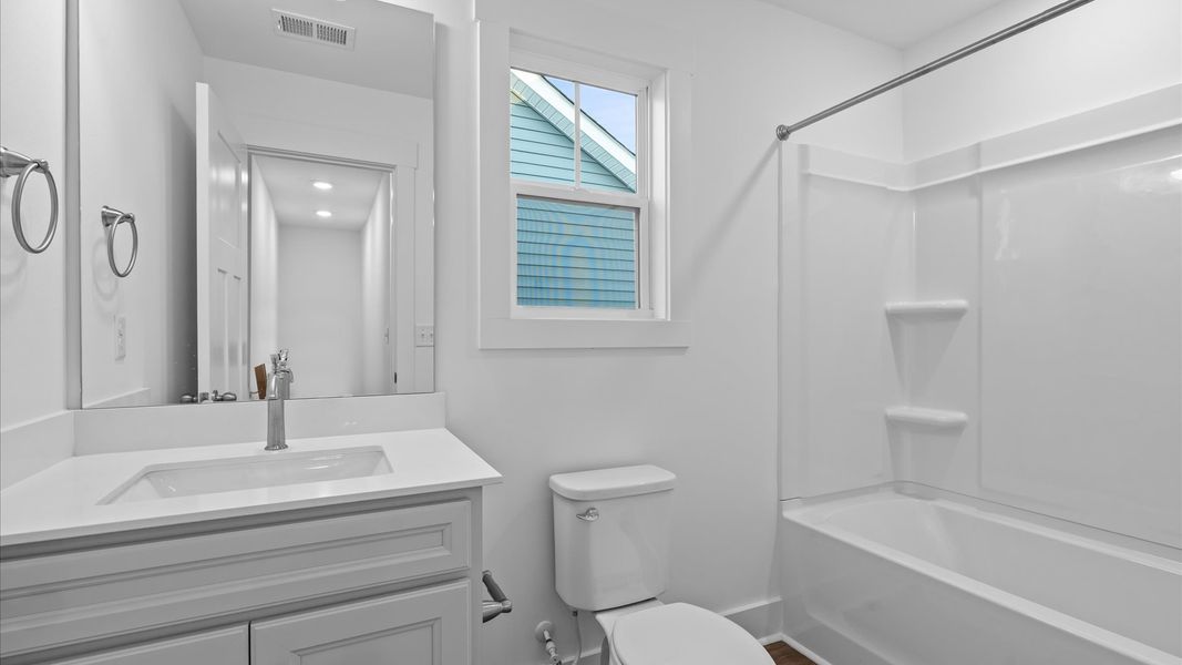 Notable full bathroom offering tasteful details and a bright, functional space