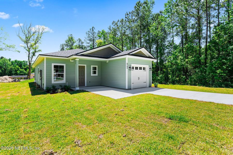 Front exterior of a new home in , Jacksonville, FL, highlighting curb appeal (Image 20).