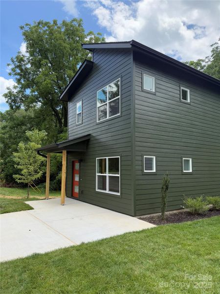 Front exterior of a new home in , Asheville, NC, highlighting curb appeal (Image 1).