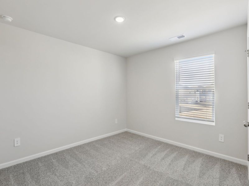 Secondary bedroom in the Dakota floorplan at 199 White Birch Lane.